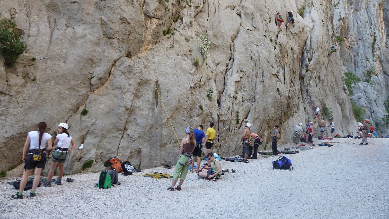 Climbers preparing and climbing on limestone walls in Paklenica National Park