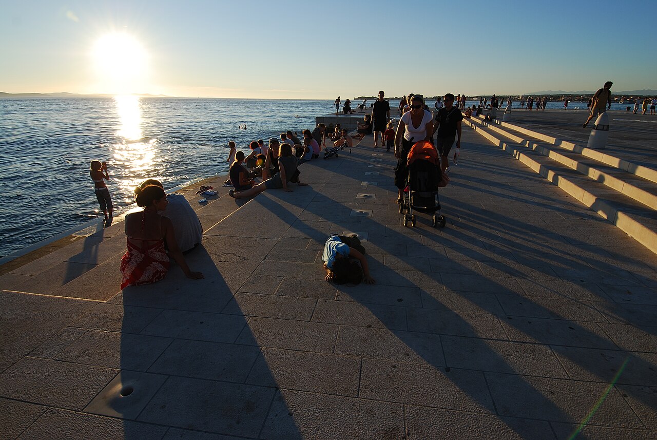 Visitors at Zadar’s Sea Organ during sunset